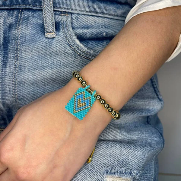 Beautiful adjustable bracelet with light blue heart charm