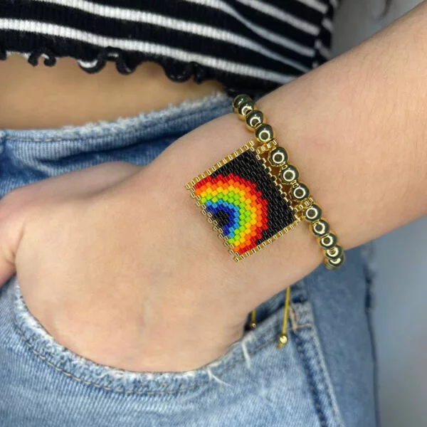 Adjustable rainbow bracelets black background